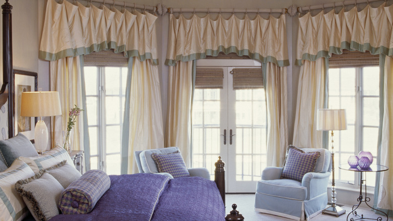 bedroom with ruffled valances on the curtains