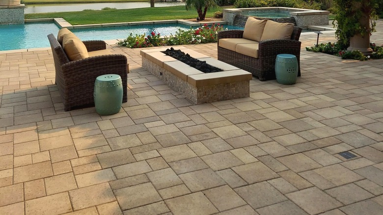 loveseats and firepit on paver patio