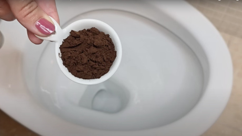 Coffee grounds near toilet