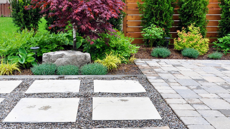 Close up of a walkway with pavers laid in gravel