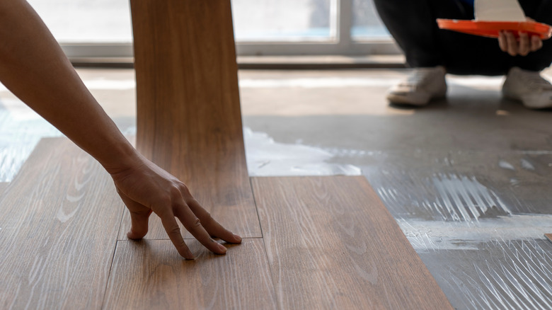 Man applying flooring