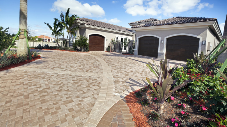 house with brick paver driveway