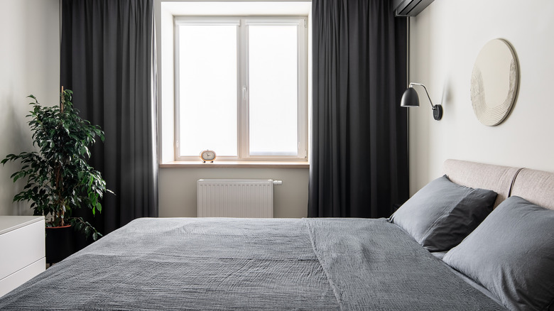 Bed with dark gray bedding