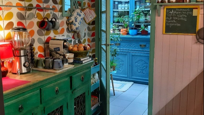 Bohemian kitchen with green cabinets