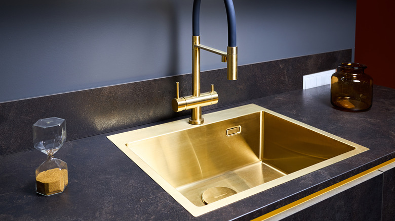 black counter with gold sink