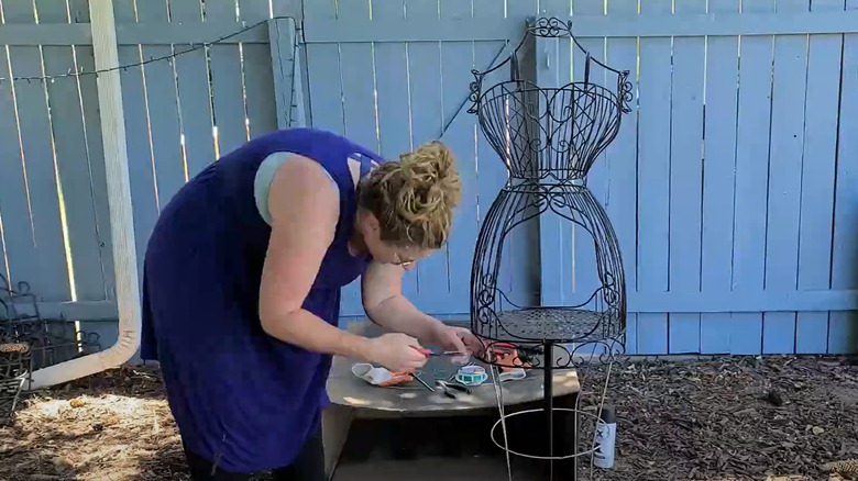 woman making dress form trellis