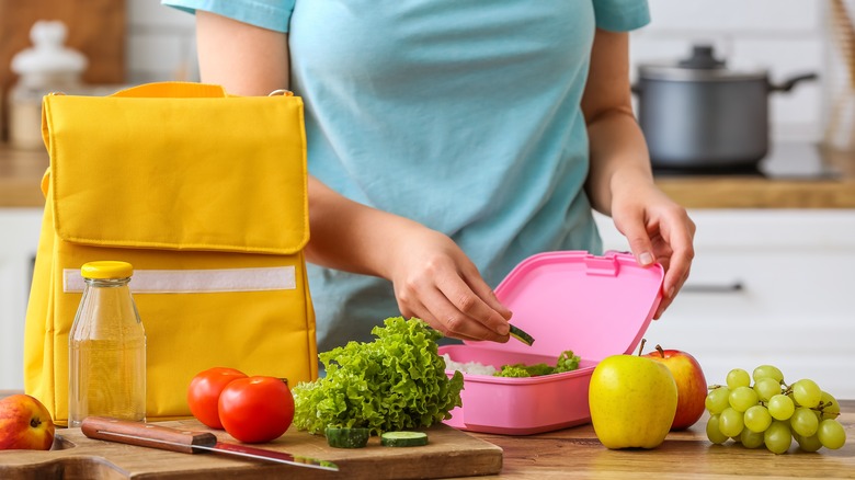 Woman packing a lunchbox