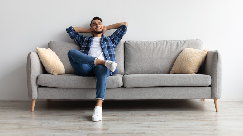 Man relaxing on couch