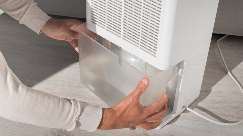 Person opening dehumidifier 