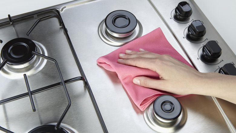 Wiping stainless steel stove top