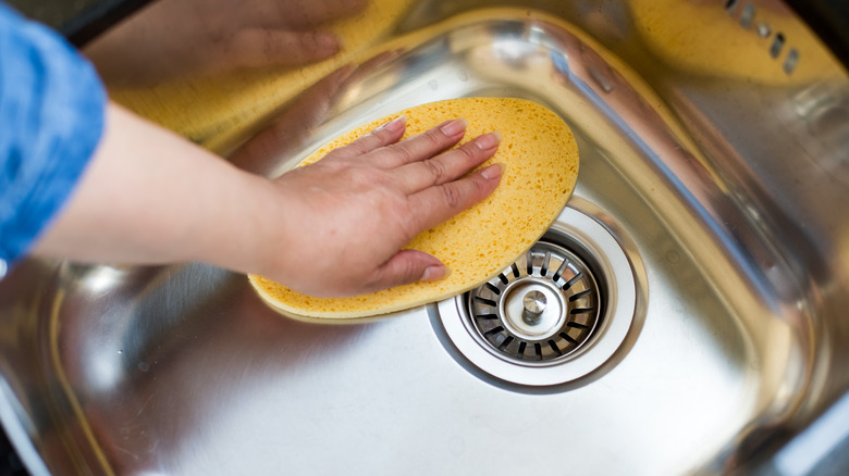 wiping stainless kitchen sink