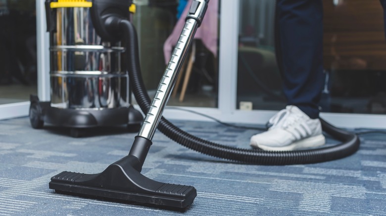 Vacuuming carpet