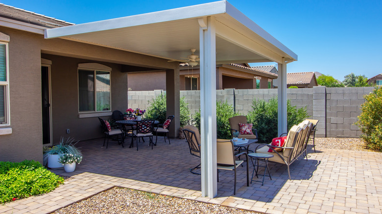 A backyard with a paver patio