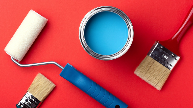 blue paint cans and brushes