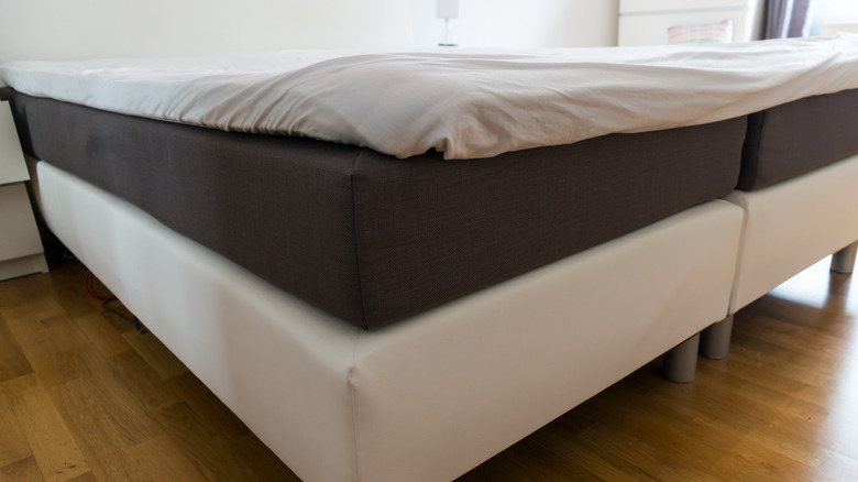 mattress on bed frame with no sheets