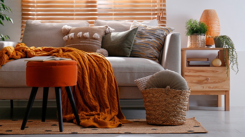 living room with orange accessories