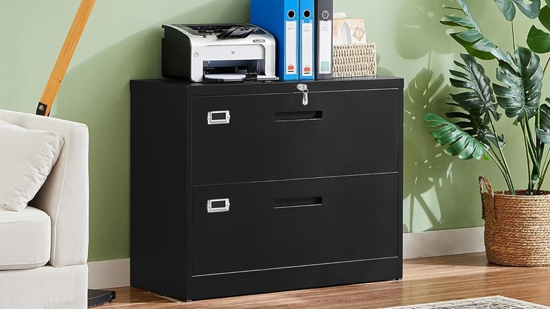 black filing cabinet with printer in decorated home office