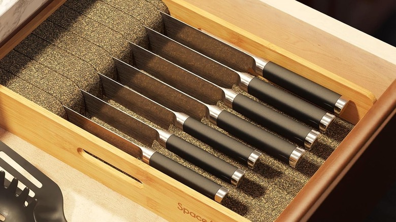 cork and rubber in-drawer knife organizer with kitchen knives