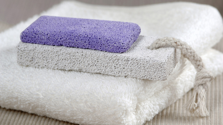 Pumice stones on a white towel