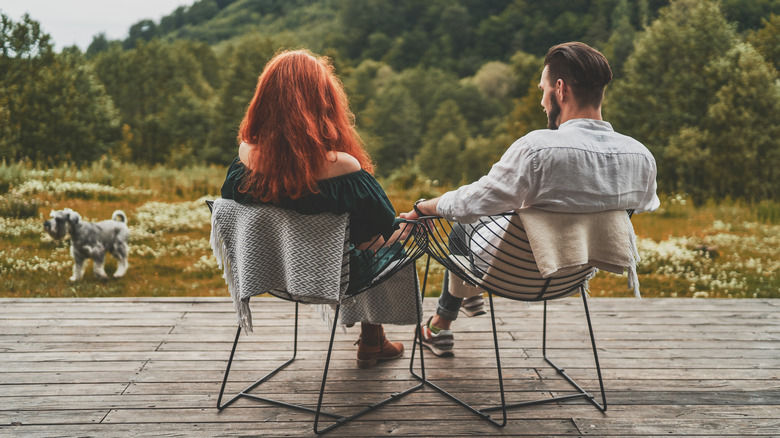 couple holding hands beautiful view