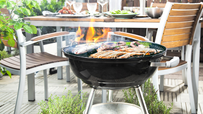 table set and food grilling outside