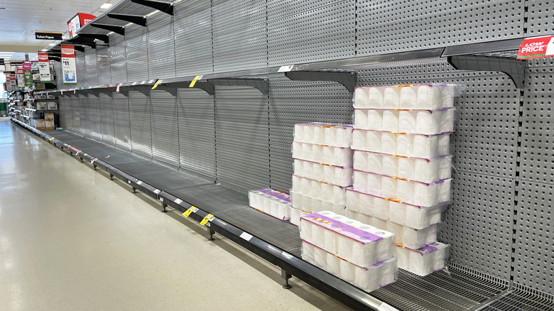 nearly empty toilet paper aisle