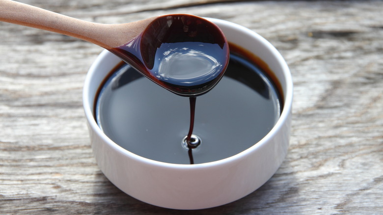 Wooden spoon in molasses