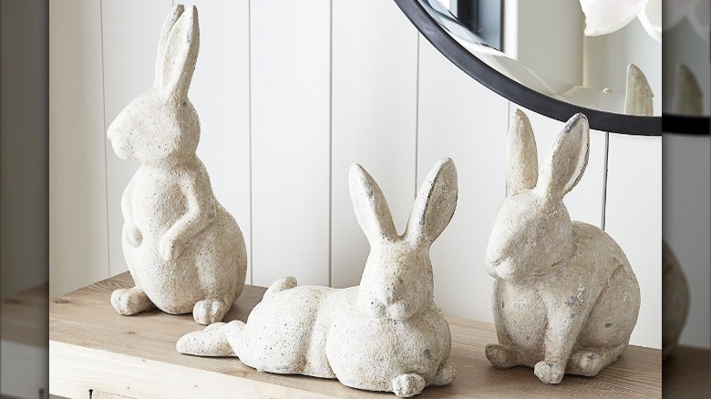 three white terracotta bunny sculptures