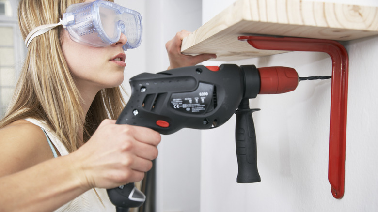 Woman using a power drill