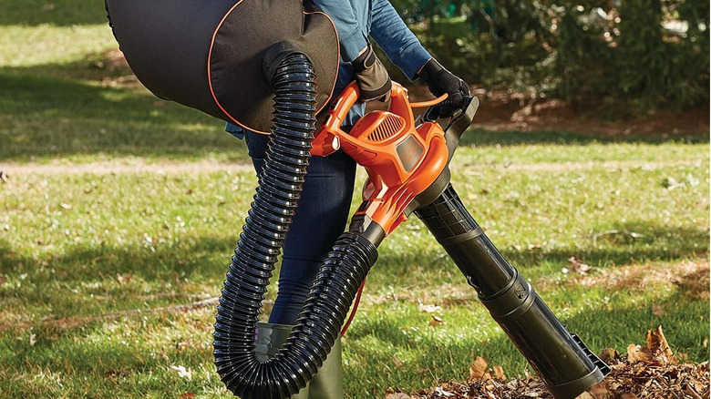 man using leaf blower