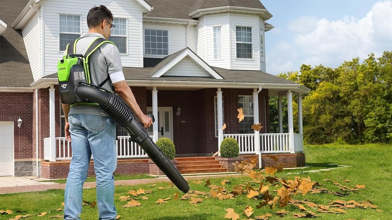 man using backpack leaf blower