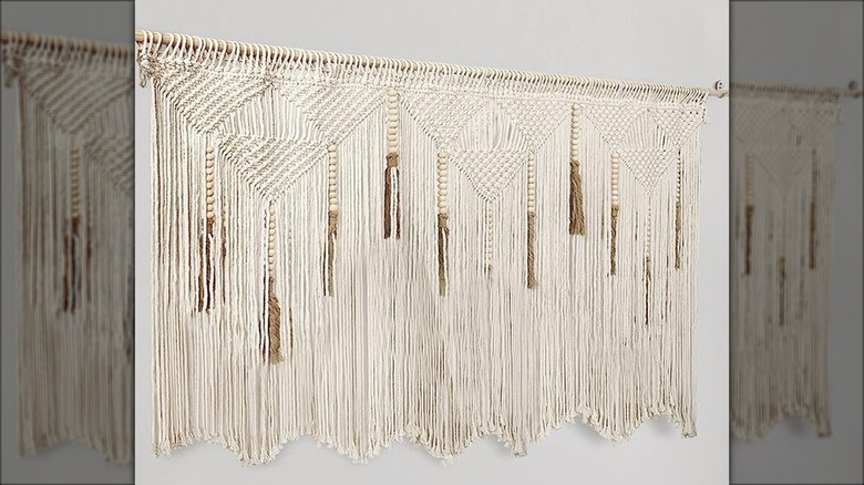 macramé piece on a wall