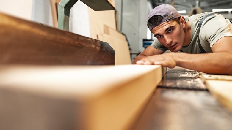 Person cutting wood