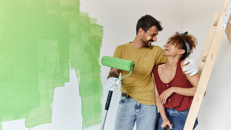 Couple getting ready to paint a wall