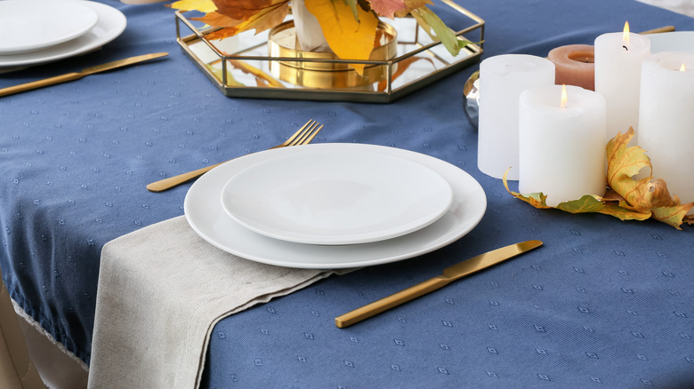fall place setting blue tablecloth