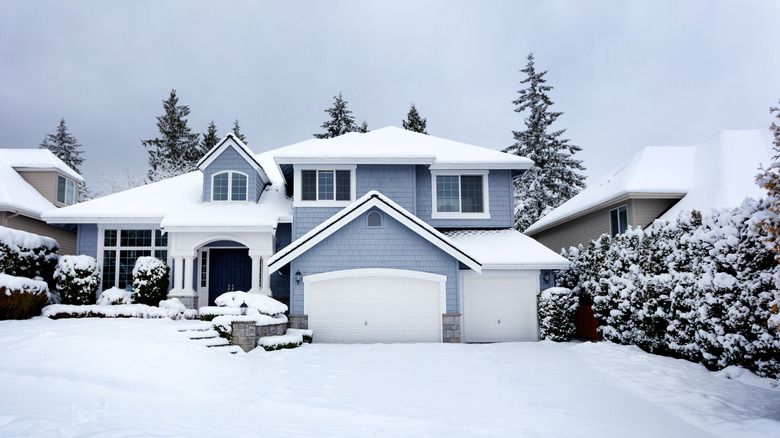 Snow surrounding home