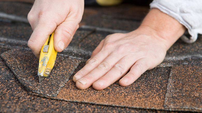 Cutting shingles with utility blade