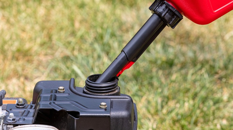 gas can filling lawn mower