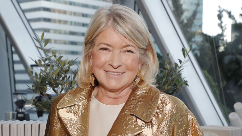 Martha Stewart attending an event while wearing a gold jacket