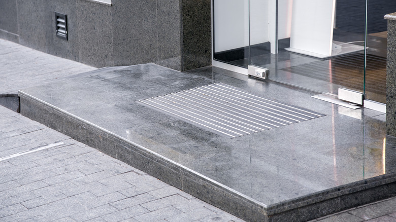 Ash mat at entrance to house with granite flooring