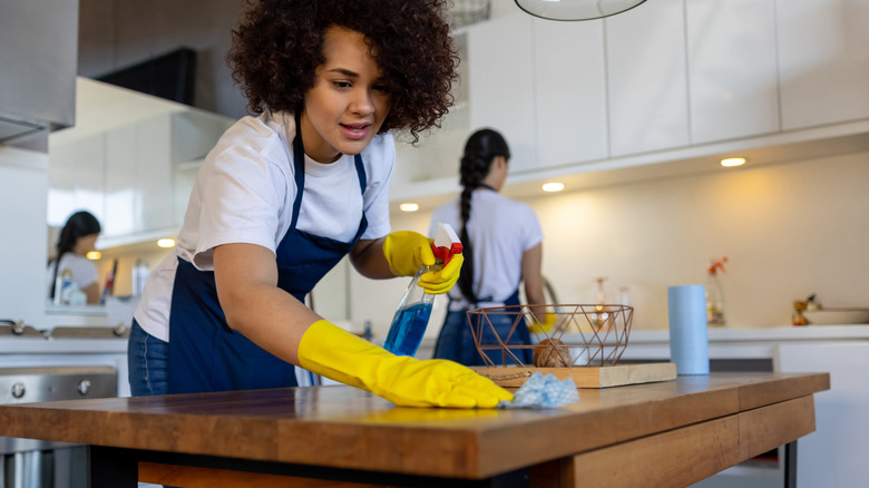 Professional cleaners cleaning kitchen