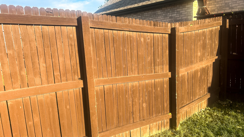 Sections of a wooden fence with backrails