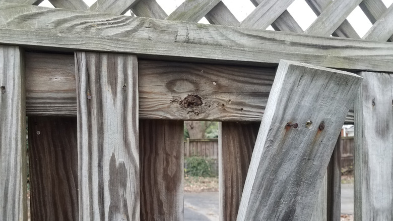 A warped wooden fence