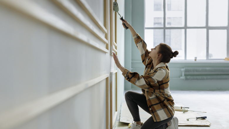 woman painting a wall