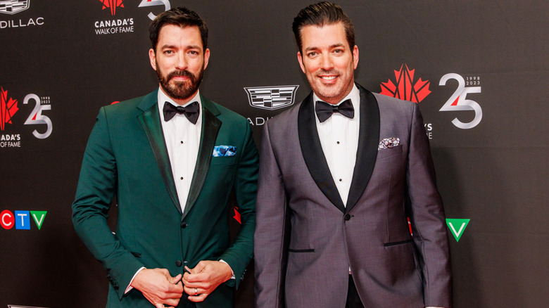 Drew and Jonathan Scott smiling on the red carpet