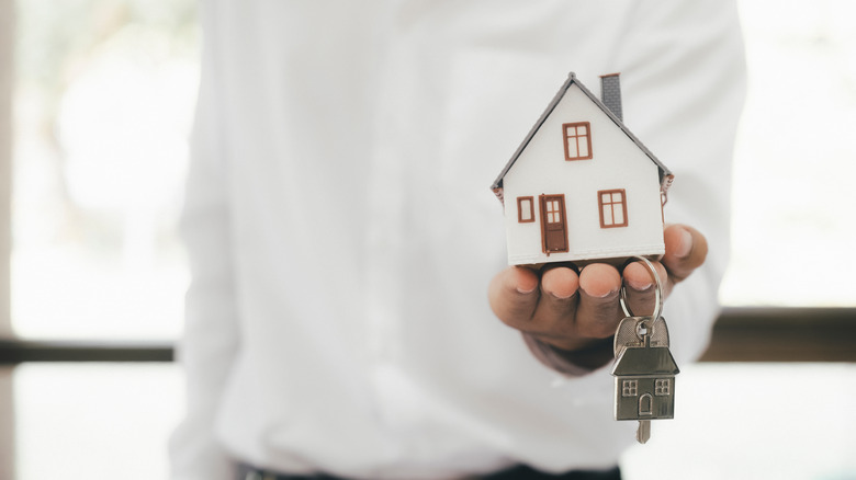 House and keys in hand