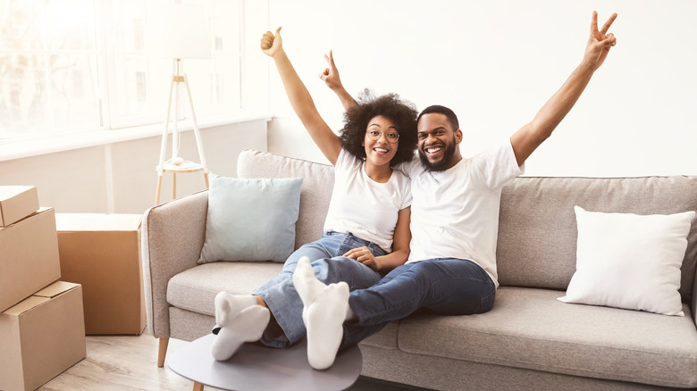 Couple smiling on a couch