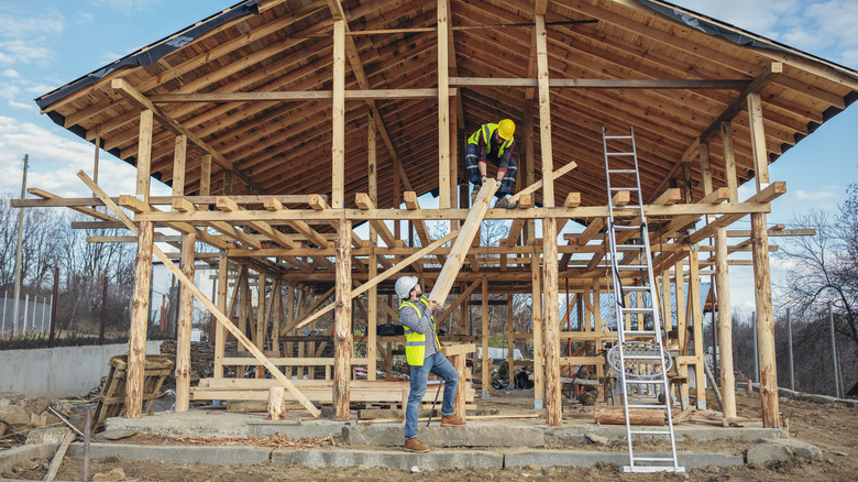 People building barn home