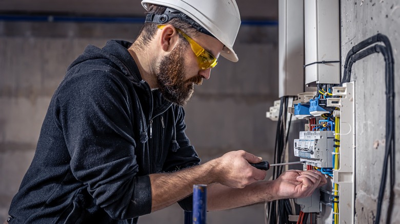 electrician working on electrical system