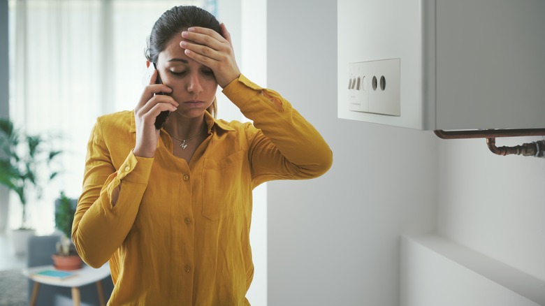 young woman calling repair service